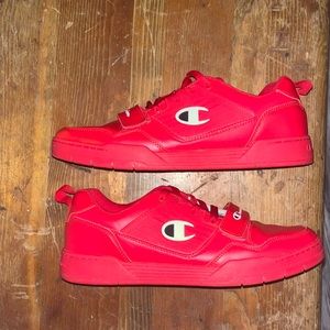 A pair of Champion 3 on 3 low top shoes.
